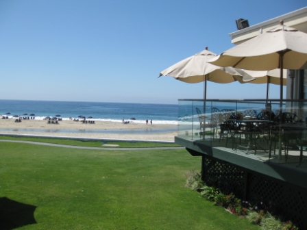 Outdoor dining and bar deck at Monarch Bay beach club.