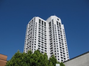 a tall white building with many windows