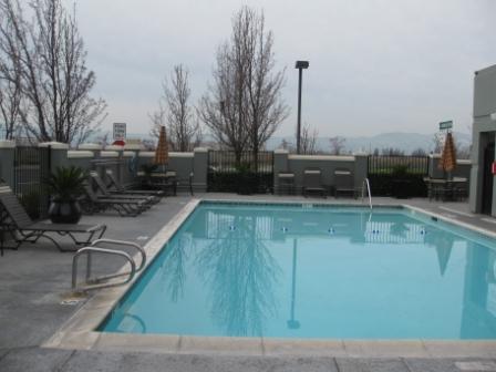 Hyatt Place Dublin pool, looking west. Oakland is on other side of hills in background.