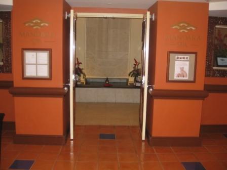 a room with orange walls and a door