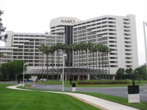 a large white building with palm trees