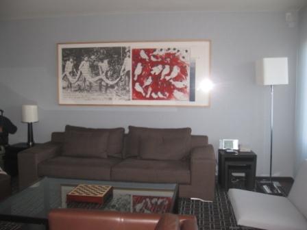 a living room with a couch and a painting
