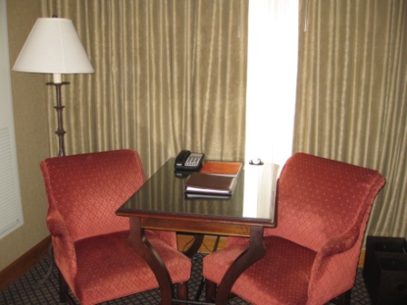 a table with chairs in a hotel room