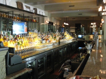 a bar with many bottles of alcohol