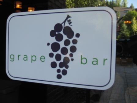 a sign with grapes on it