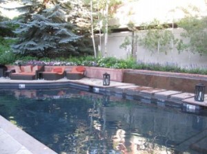 a swimming pool with a bench and a bench