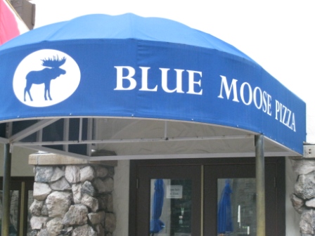 a blue awning with a logo on it