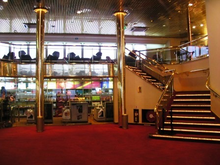 a large room with red carpet