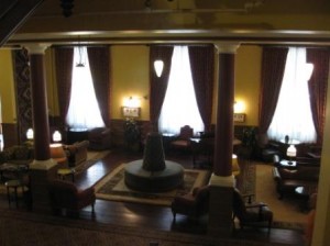 a room with a large round fountain