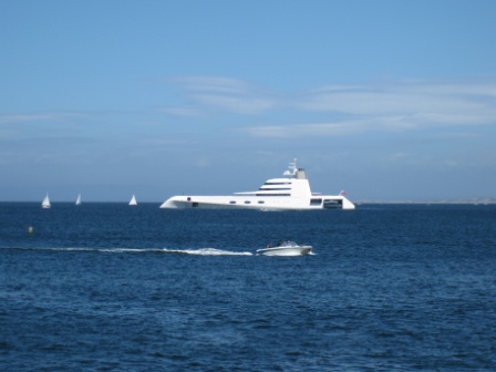 a large white boat in the middle of the ocean