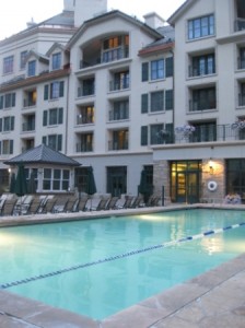 a swimming pool in front of a building