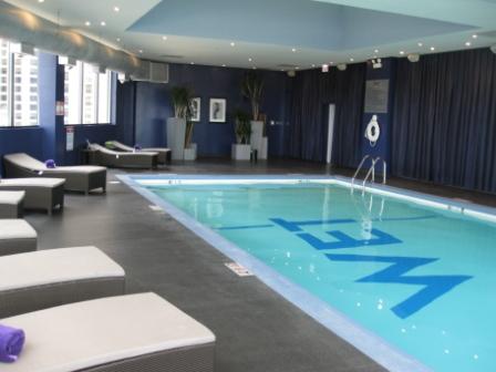 a indoor pool with a blue sign