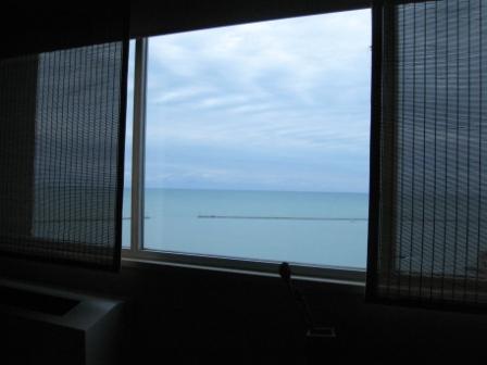 a window with a view of the ocean