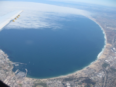 an aerial view of a beach and land