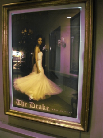 a framed picture of a woman in a white dress
