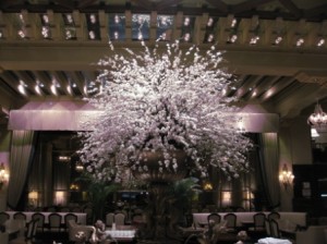 a large vase with white flowers