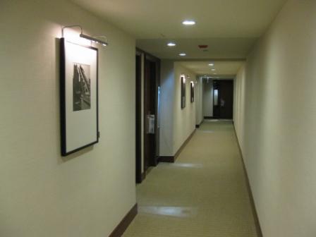 long hallway with a picture on the wall