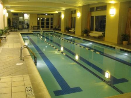 a indoor swimming pool with a large pool