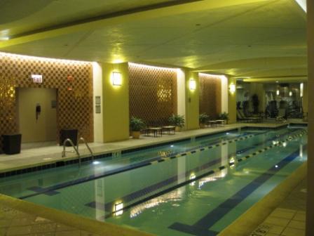 a indoor swimming pool with a couple people