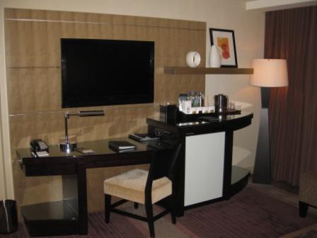 a desk and chair in a hotel room