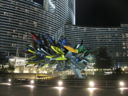 a sculpture of boats in front of a building