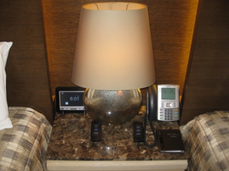 a telephone and a lamp on a table