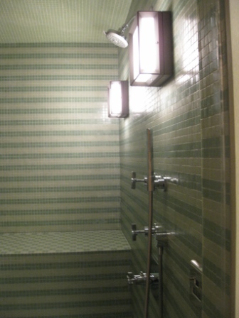 a shower with a light fixture