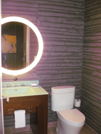 a bathroom with a round light