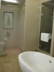 a bathroom with a glass shower door