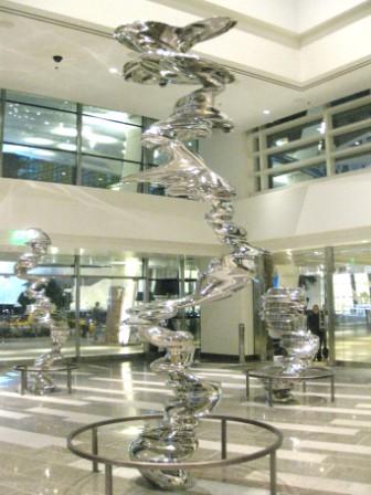 a large metal sculpture in a lobby