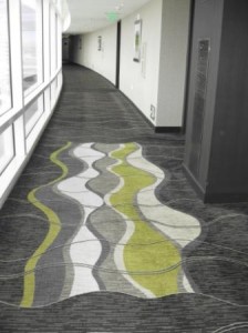 a long hallway with a carpeted floor