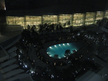 a pool in a hotel at night