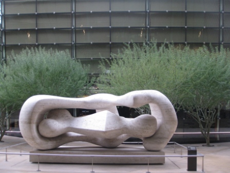 a sculpture in front of a building
