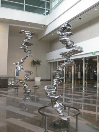 a large silver sculpture in a lobby