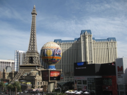 a large building in the background with Paris Las Vegas in the background