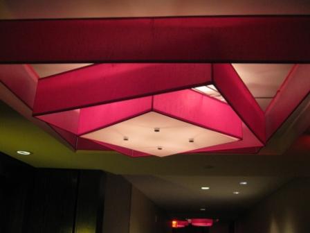 a pink and white ceiling light