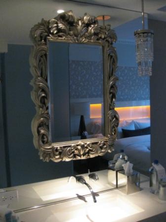 a mirror above a sink