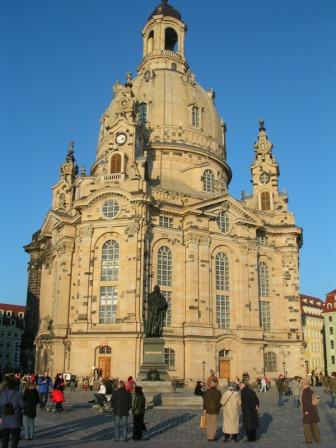 a large building with a dome with Dresden Frauenkirche in the background