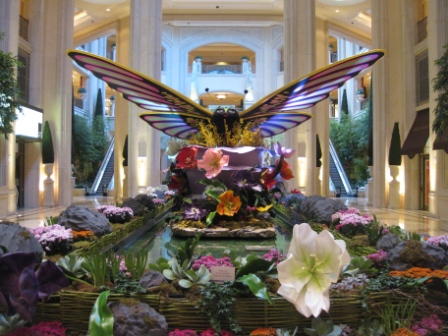 a butterfly statue in a lobby