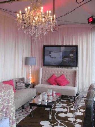 a living room with a chandelier and couch