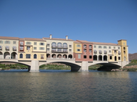 a bridge over water with a building