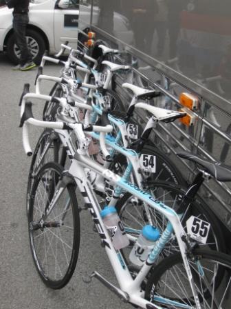 a row of bicycles lined up