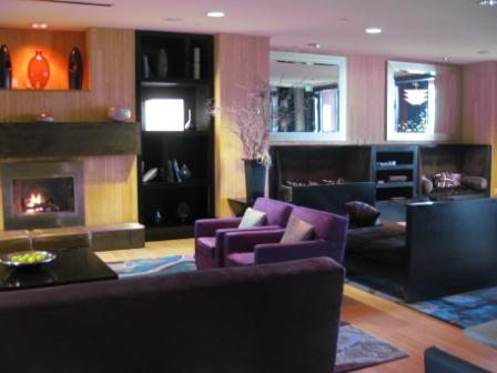 a living room with purple furniture