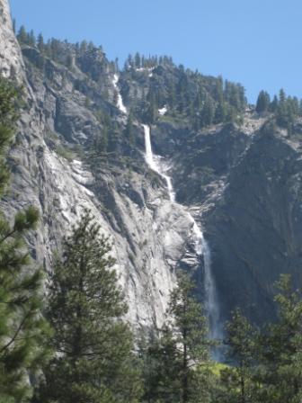 a waterfall falling down a mountain