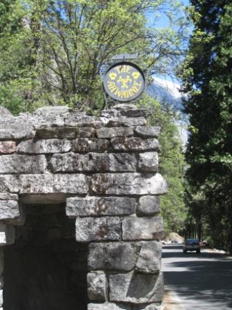 a stone wall with a sign on top