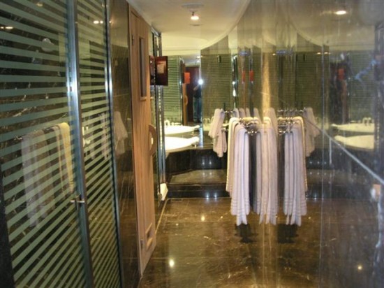 a bathroom with towels on the swingers