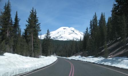 a road with snow on the mountain