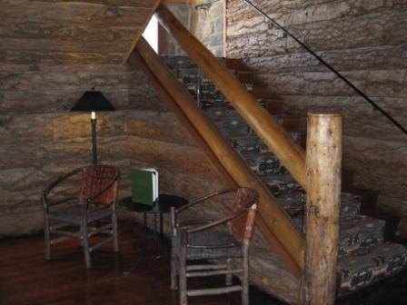 a wooden staircase in a log cabin