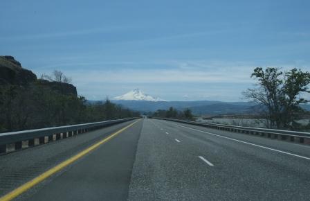 a road with a mountain in the background