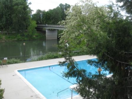a swimming pool next to a bridge